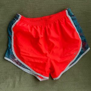 Orange Nike running shorts, XS